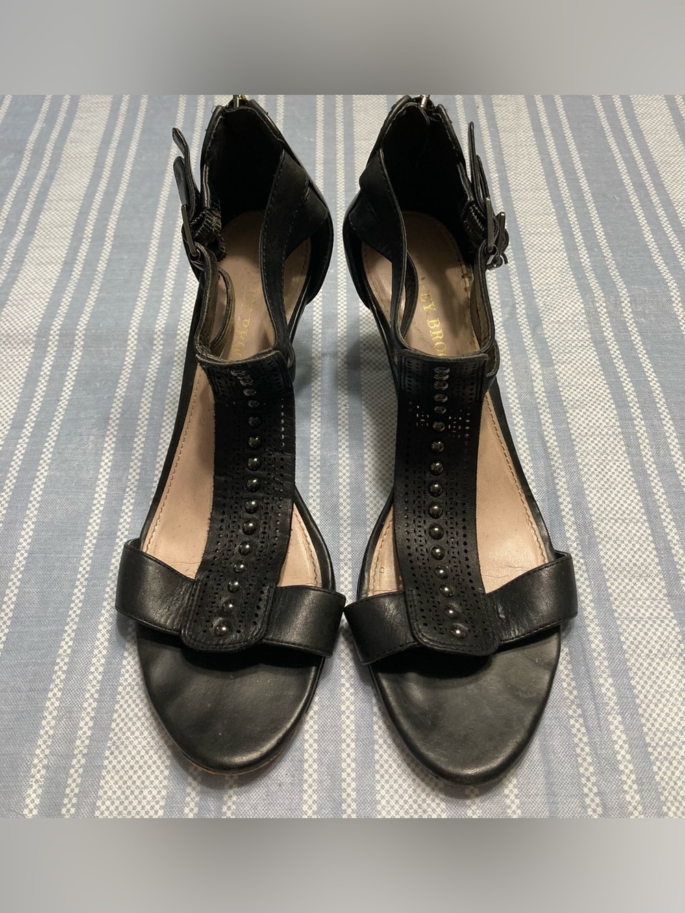 Audrey Brooke black heeled sandals.